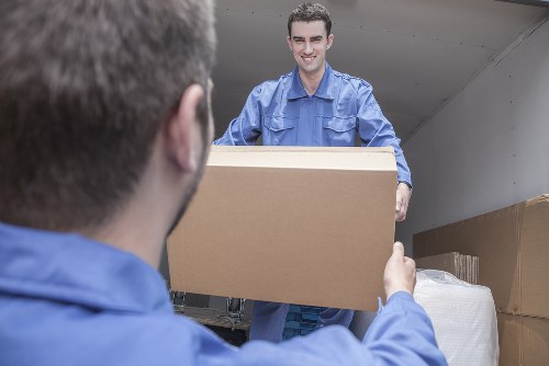 Packing boxes and household items prepared for a move in Malden Rushett