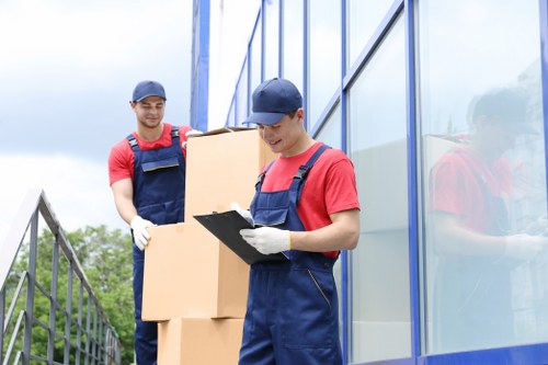 Office relocation planning in Malden Rushett with moving team and packed boxes