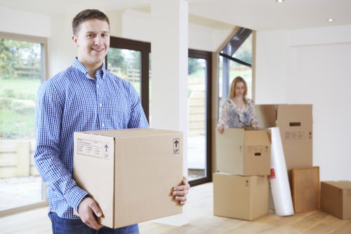 Professional office movers loading business items for a Malden Rushett move