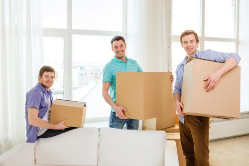 Loading furniture into a removals van near Malden Rushett