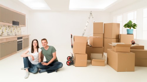 Professional movers loading household items for transport from Malden Rushett