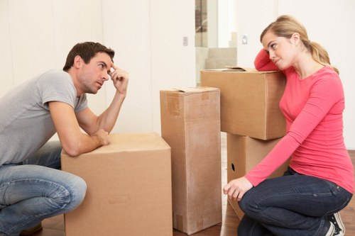 Professional movers carrying furniture during a home move
